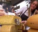 wheel of cheese being cut in Piedmont