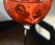 Aperol Spritz drink, served in a class bright red color iced and orange slices