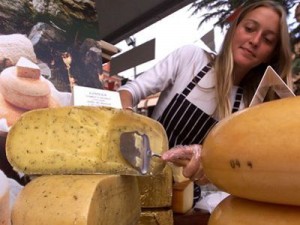 wheel of cheese being cut in Piedmont