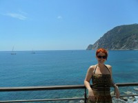Cinzia posing in front of the water/ocean