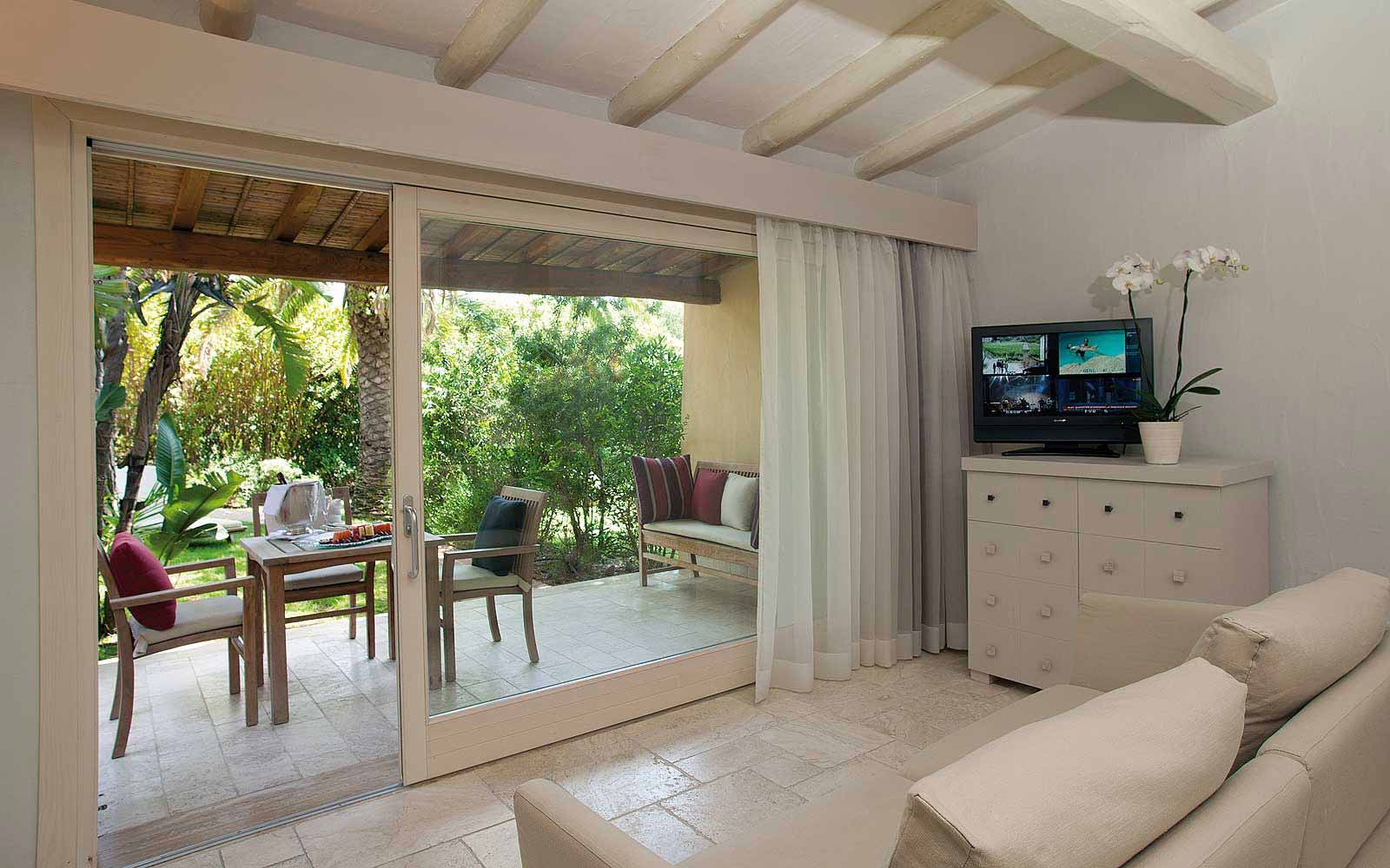 A Deluxe Bungalow patio at Forte Village Le Dune