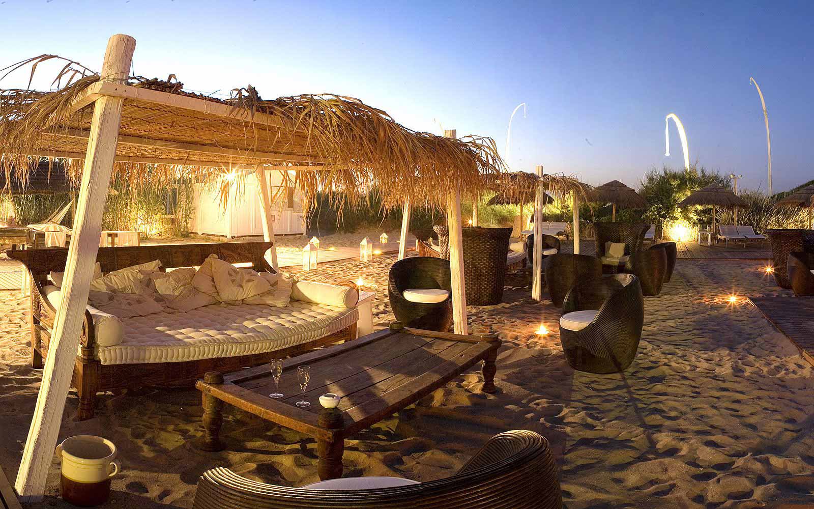 Outdoor lounge by the beach at Masseria Torre Maizza